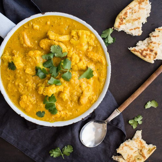 Kipmengsel met bloemkool en kokosmelk