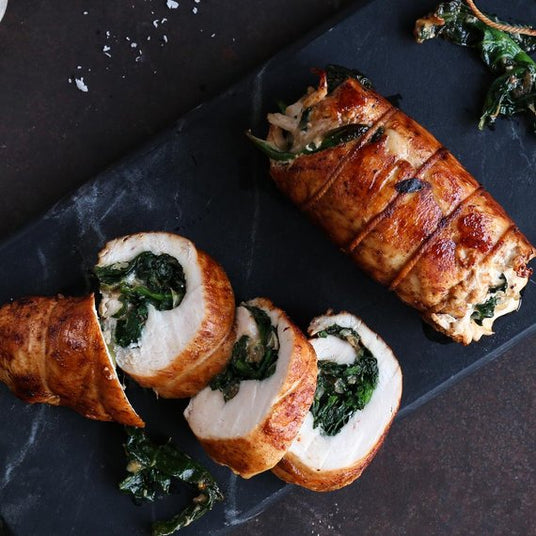 Kiprolletjes gevuld met spinazie en parmezaan